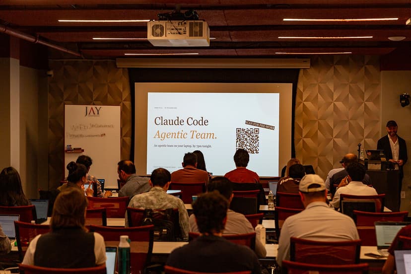 Wide shot of a packed training session — every seat filled